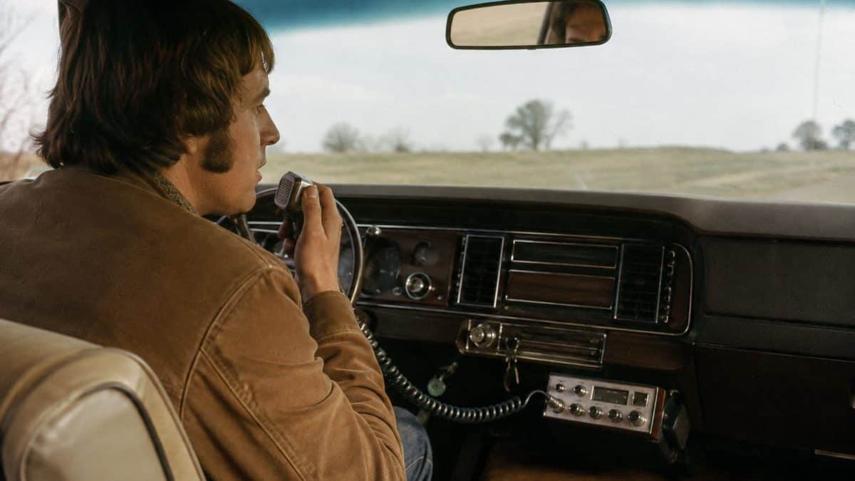 13 Family Road Trip Rituals from the '70s Nobody Does Anymore 9 Driver using a CB radio.