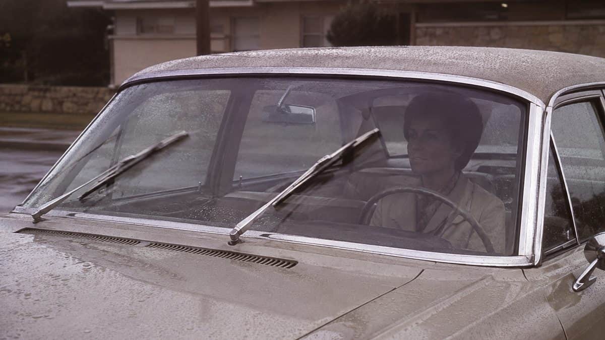 Vintage car windshield wipers in rain