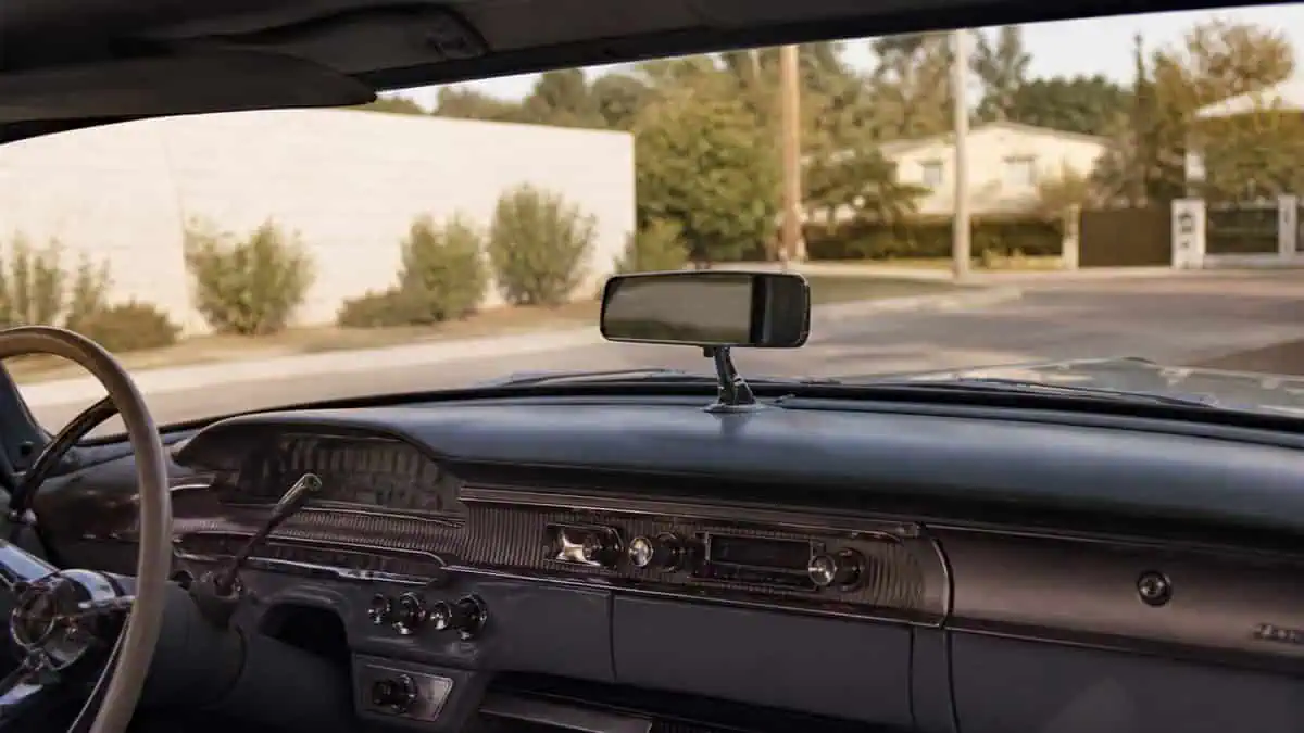 Vintage car with dash-mounted mirror