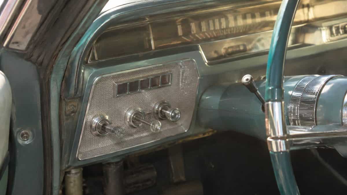 Real vintage car dashboard showing a pull-out lights switch