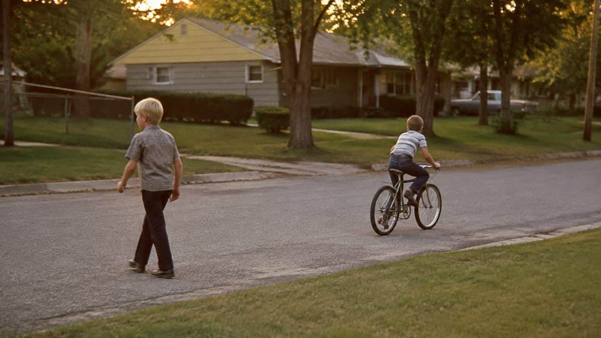 Parenting Practices from the '60s That Were Completely Normal Then 2 Real vintage photo of kids playing outside in the evening
