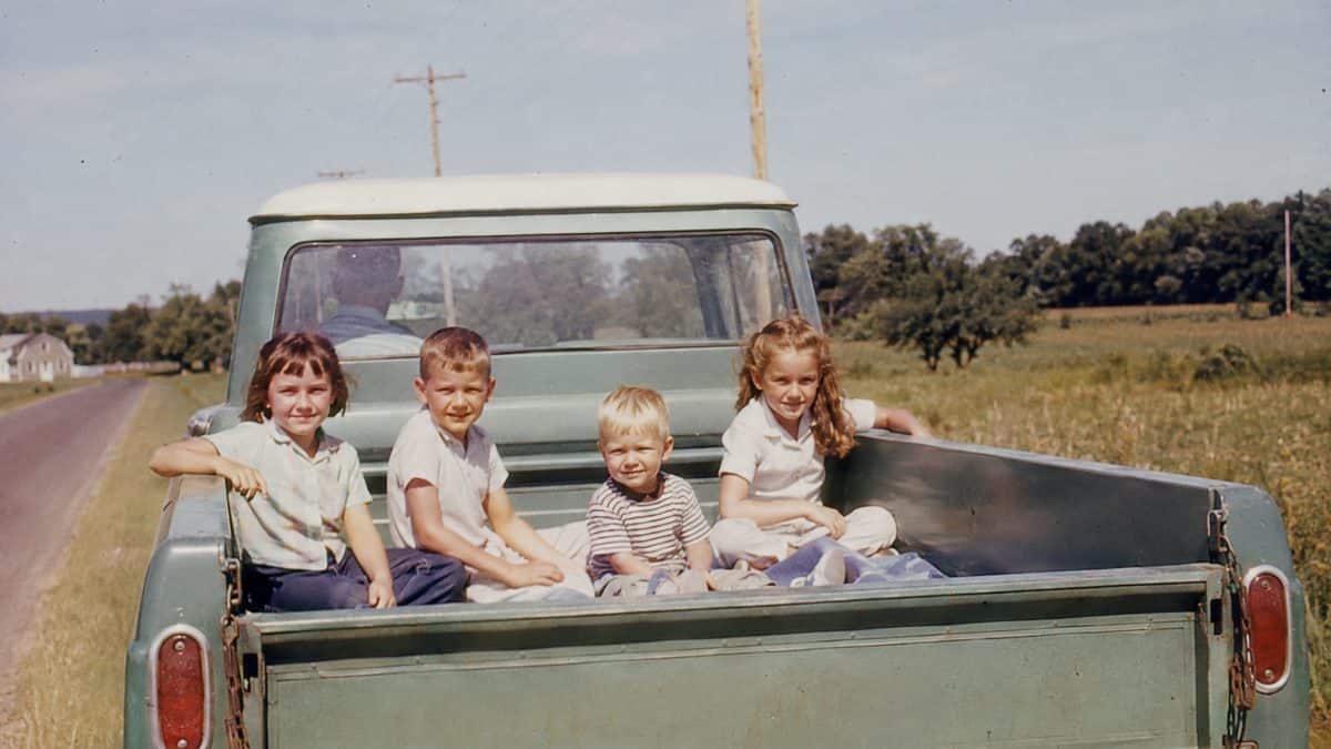 Parenting Practices from the '60s That Were Completely Normal Then 7 Kids riding in the back of a pickup truck