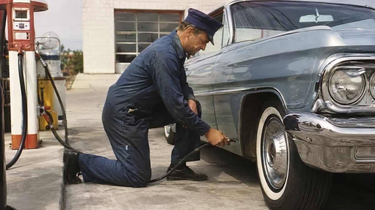 15 Gas Station Services We Took for Granted in the '60s 5 Genuine archival photo of a gas station attendant checking tire pressure