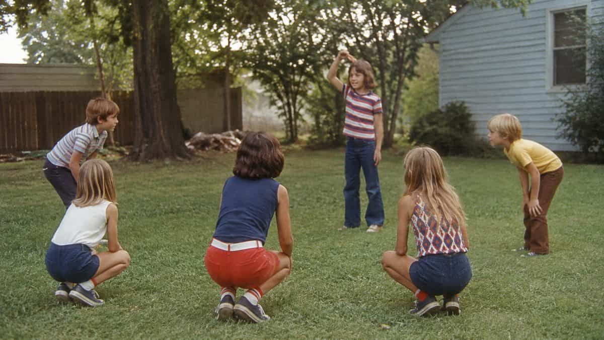 Backyard Games from the '70s That Kept Kids Outside Until Dark 10 Children playing Simon Says outdoors