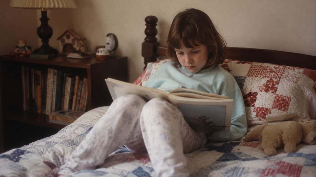 Child reading a book.