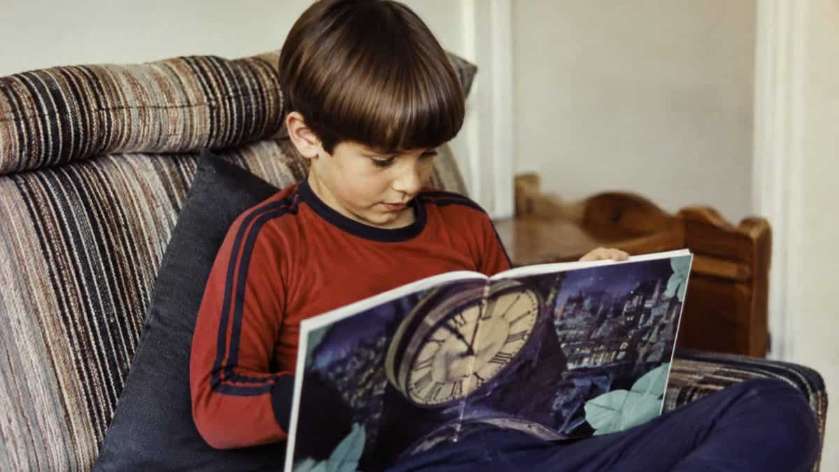 Child reading a picture book.