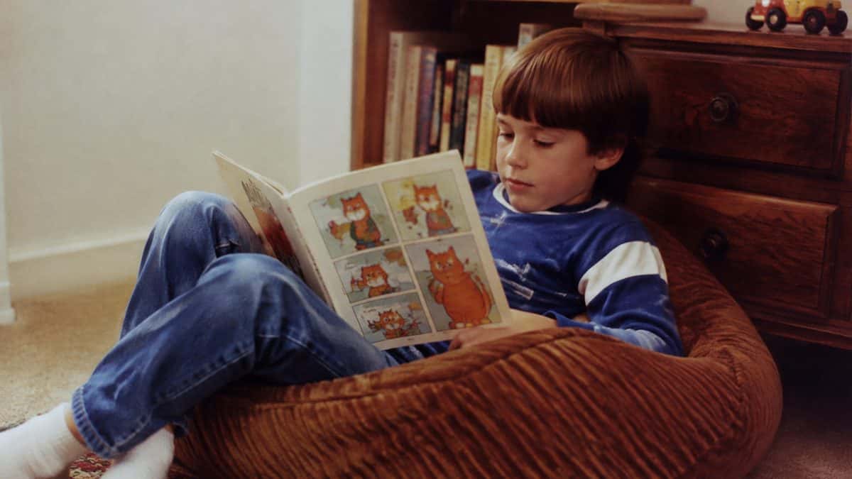 14 Unforgettable '80s Cartoon Characters You Loved 14 Vintage 1980s photo of a child reading a comic book