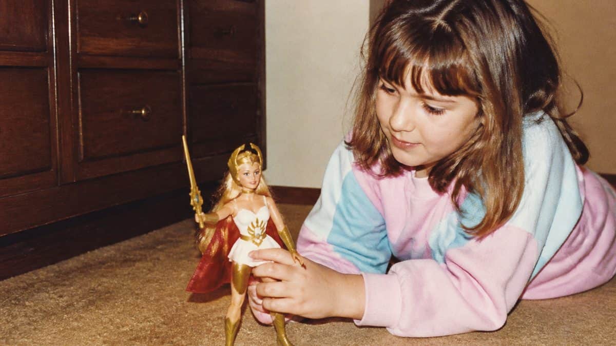 14 Unforgettable '80s Cartoon Characters You Loved 9 Vintage 1980s photo of a child playing with a She-Ra toy