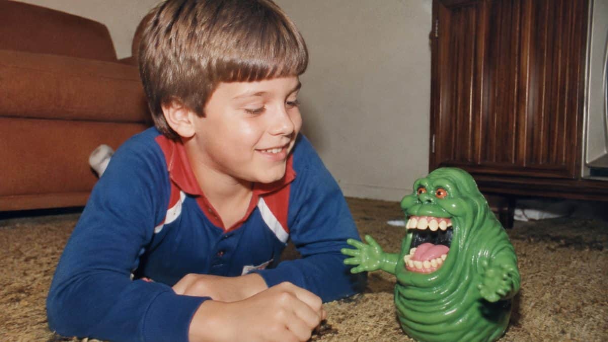14 Unforgettable '80s Cartoon Characters You Loved 10 Vintage 1980s photo of a child with a Slimer toy