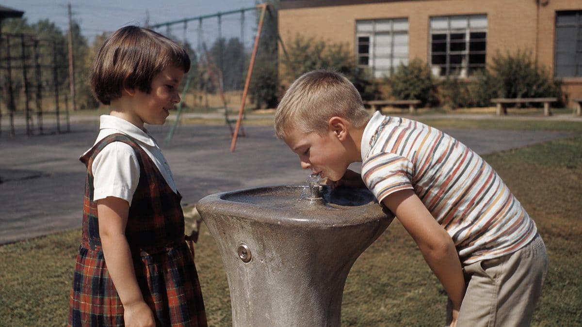 Children at a water fountain