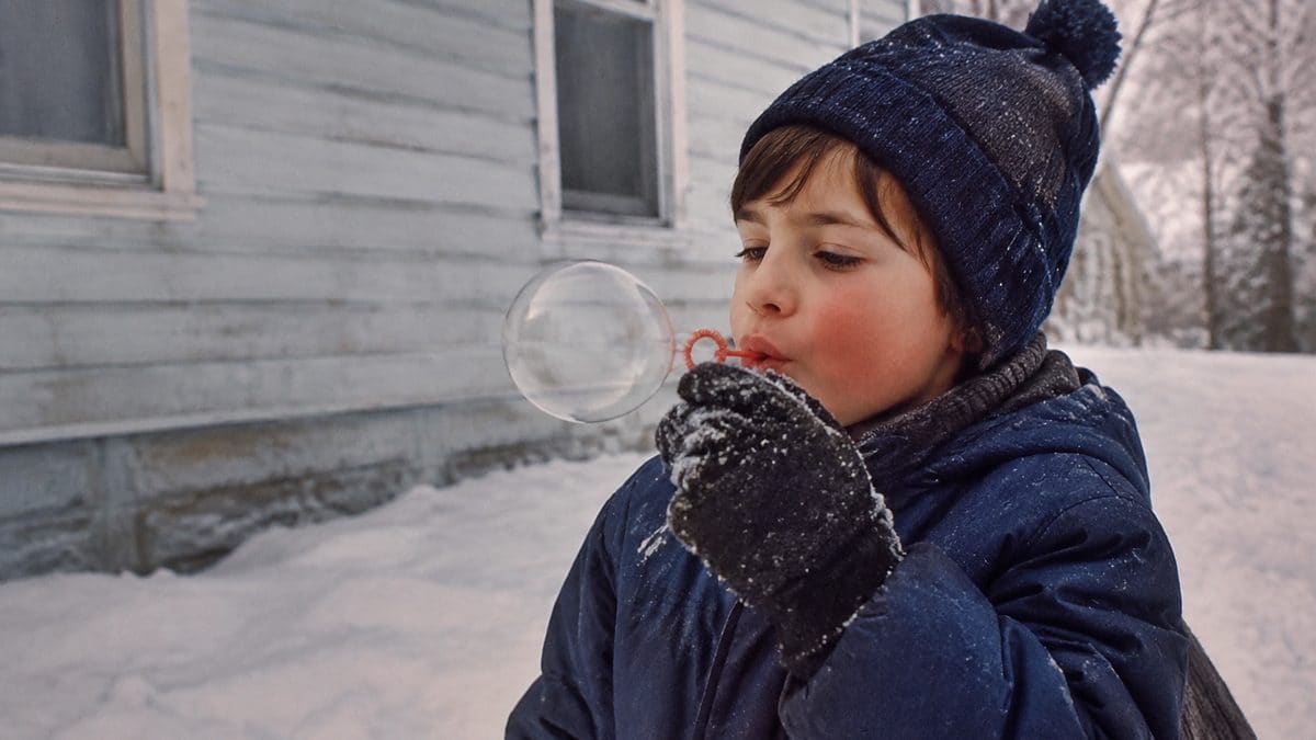 Child playing in the snow