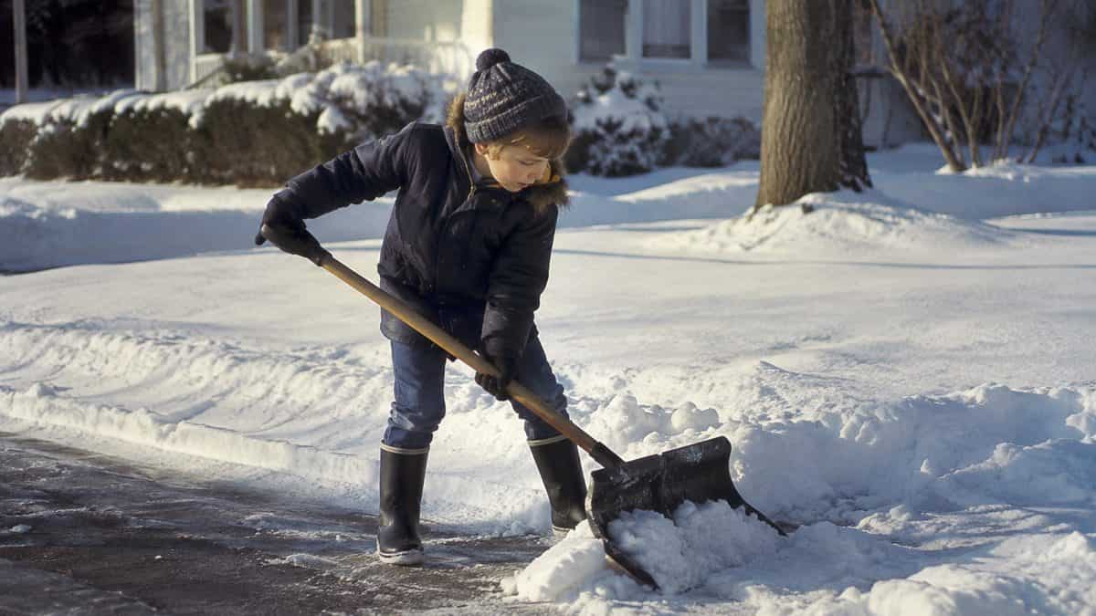 Child shoveling snow