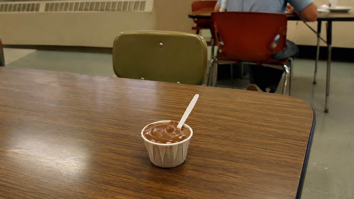 School lunch chocolate pudding in a genuine thin paper cup