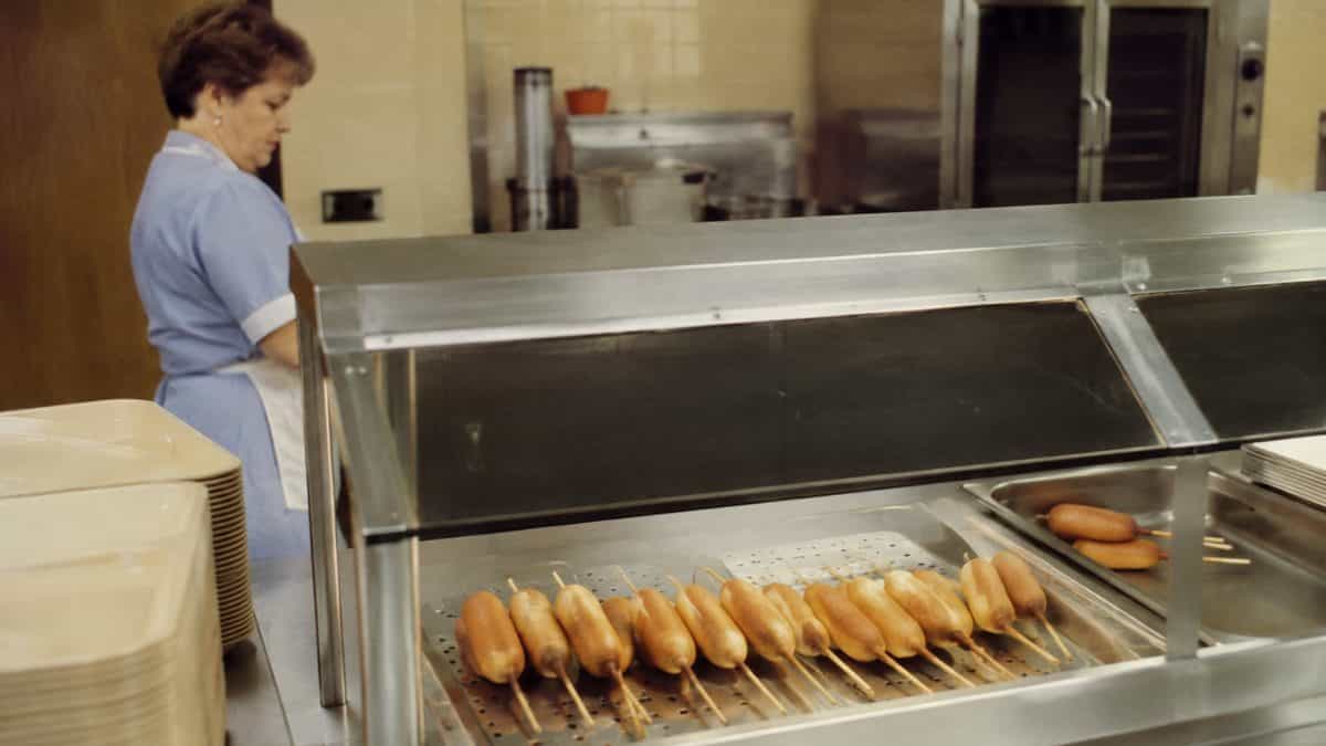 Corn dogs in a cafeteria setting
