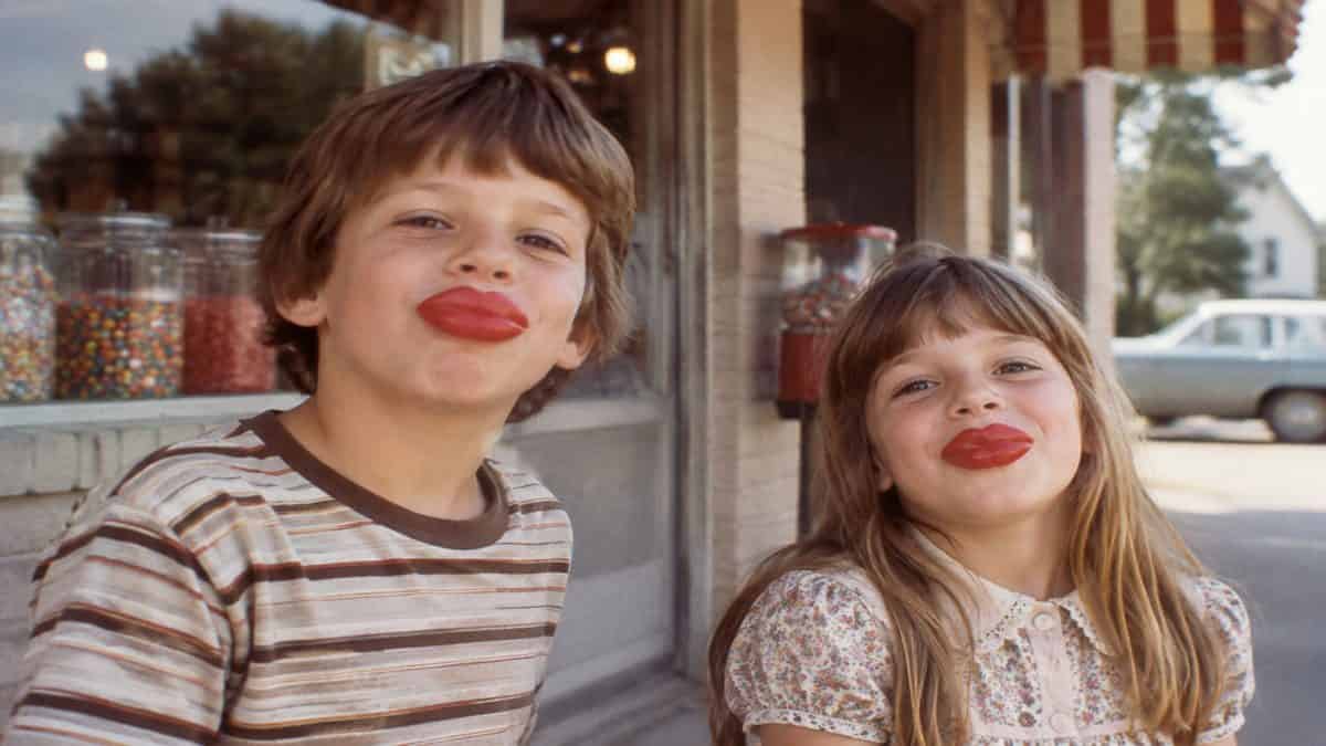 Kids playing with wax lips.