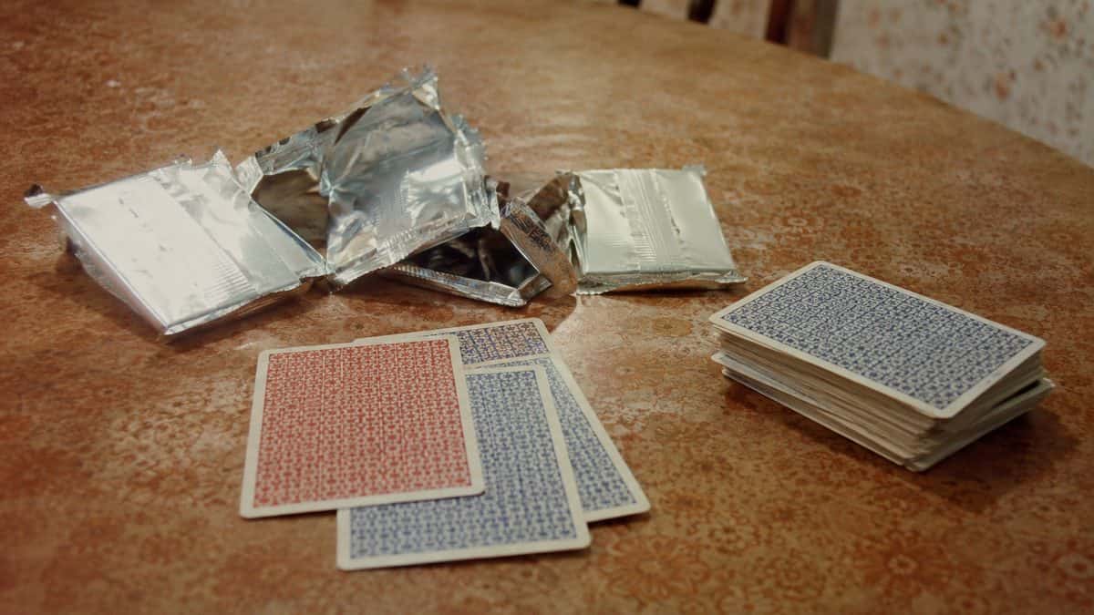 Child opening real vintage trading cards.