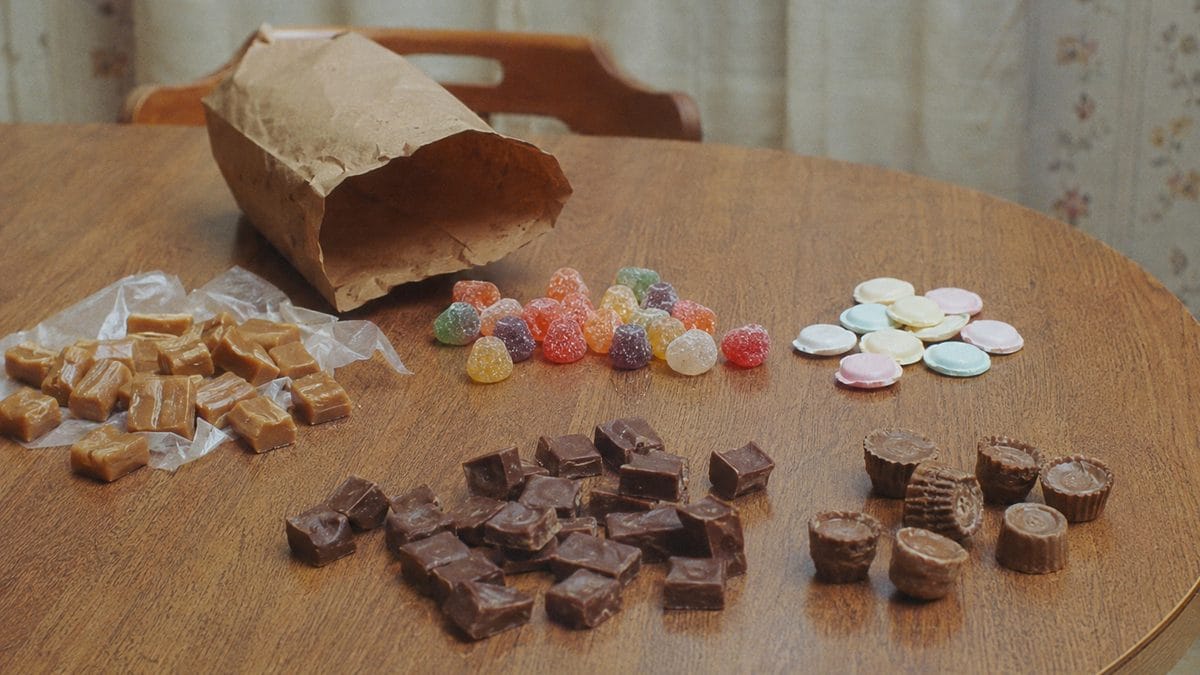 Candy store counter with legible signage.