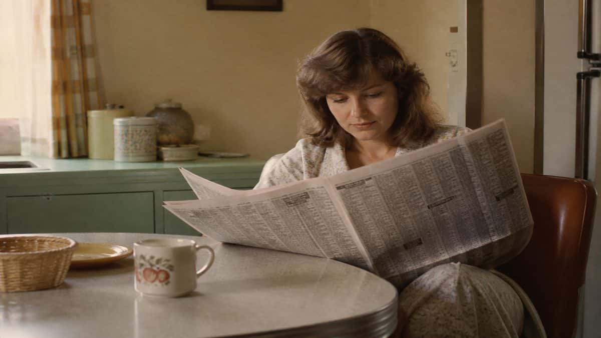 Woman reading newspaper