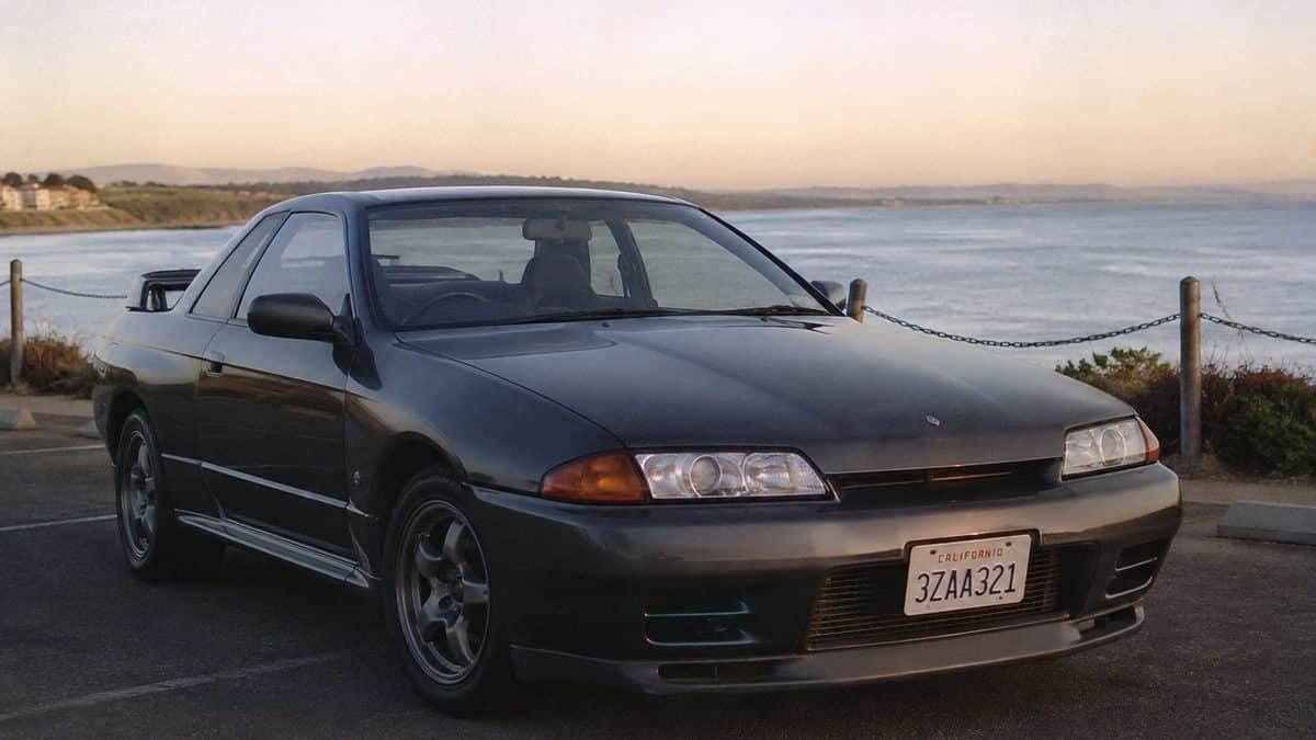 1989 Nissan Skyline GT-R with a legible license plate.