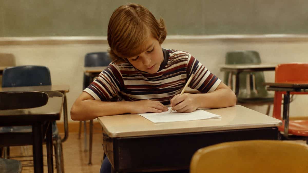 Left-handed student writing