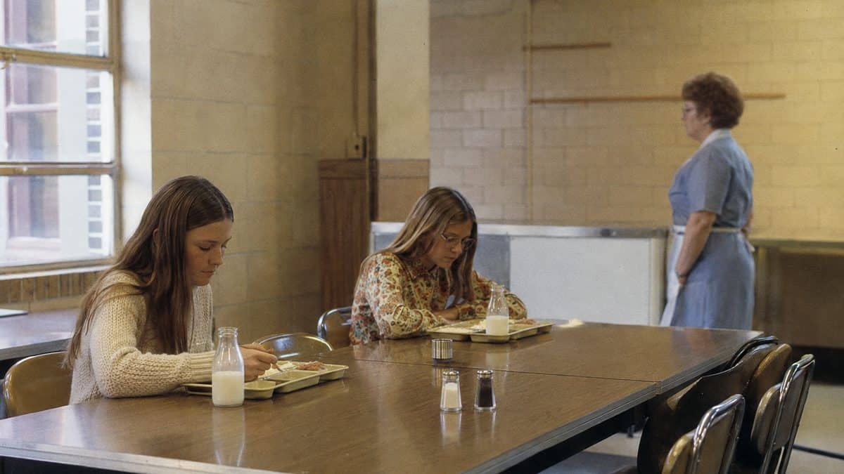 Students in a 1970s school cafeteria