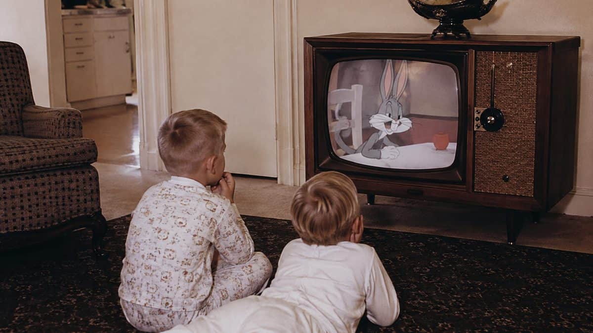 16 Saturday Morning Cartoons That Defined Your Childhood 2 Authentic vintage animation cel or photo of kids watching TV