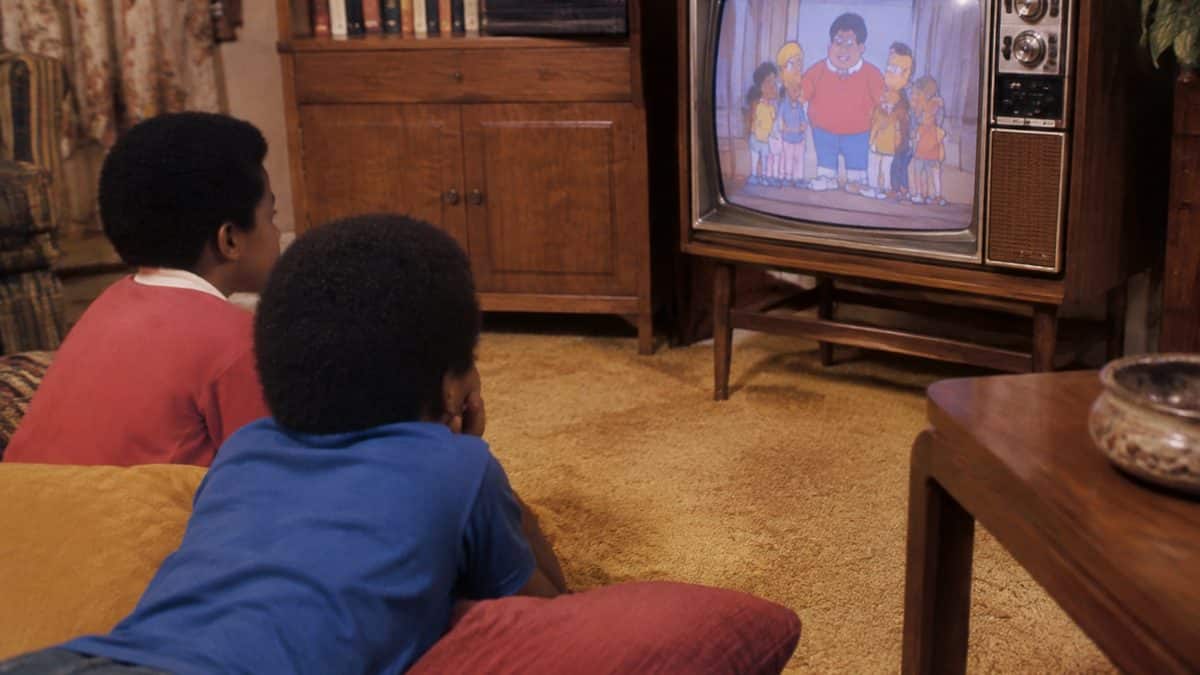 16 Saturday Morning Cartoons That Defined Your Childhood 6 Vintage Fat Albert merchandise or children watching a retro TV.