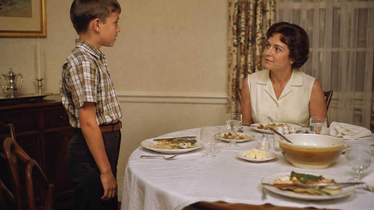 12 Forgotten Dinner Table Rules That Would Surprise Kids Today 5 Authentic 1960s photo of a child standing at a dinner table