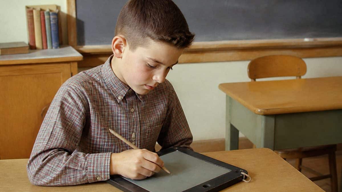 Remember These? 14 School Supplies That Defined the '50s Classroom 6 Student using a Big Chief tablet
