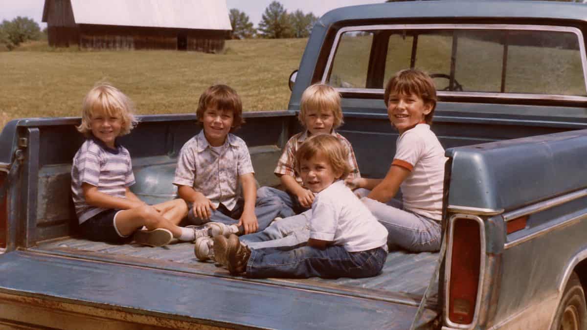 Parenting Practices from the Past That Would Be Illegal Today 2 Genuine vintage snapshot of children sitting in the bed of a pickup truck.