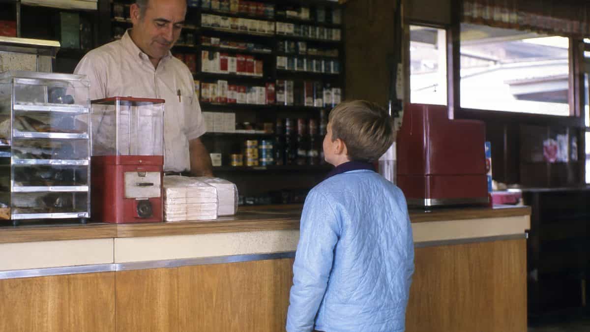 Parenting Practices from the Past That Would Be Illegal Today 4 Child at a convenience store counter.