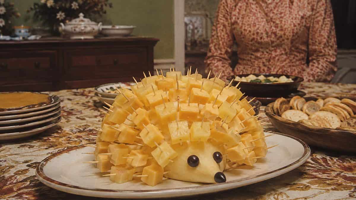 13 Party Foods from the Seventies That Should Make a Comeback 13 Genuine vintage photo of a cheese and pineapple hedgehog at a party.