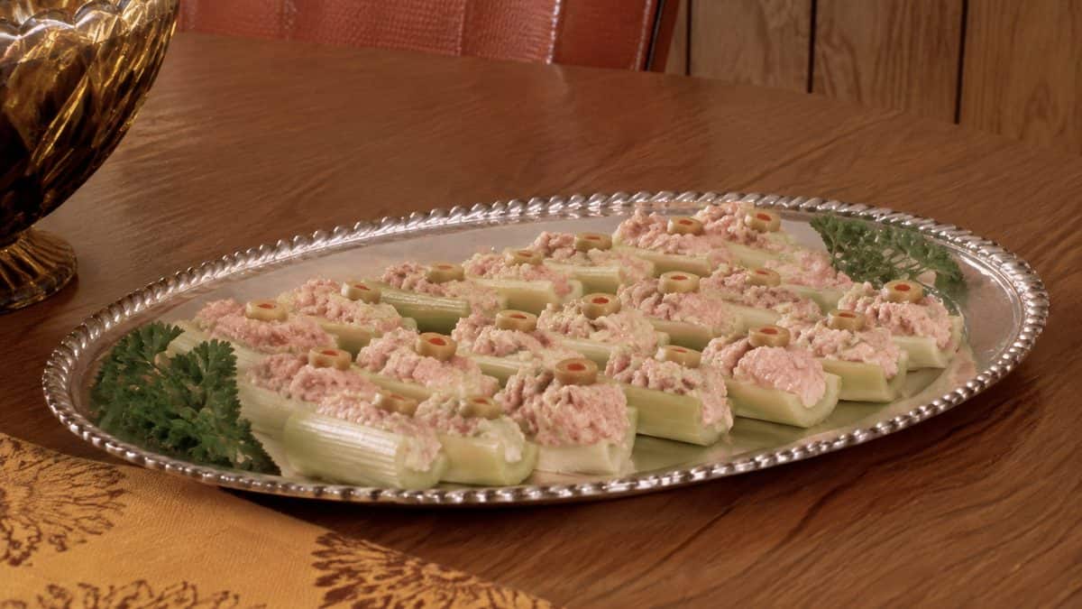 13 Party Foods from the Seventies That Should Make a Comeback 5 Stuffed celery appetizers on a vintage platter