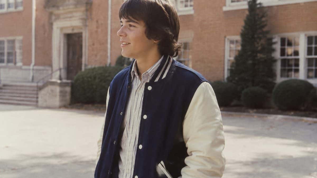 Dating Rules from the '70s That Sound Completely Insane Now 13 Authentic 1970s photo of a teenager in a letterman jacket.