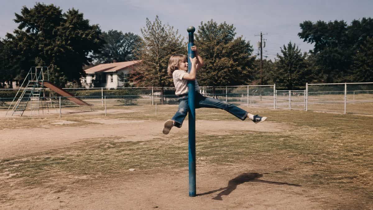 Remember These? 15 Playground Equipment Pieces That Would Never Pass Safety Standards Today 7 Authentic historical photo of children using a Giant Stride playground pole.