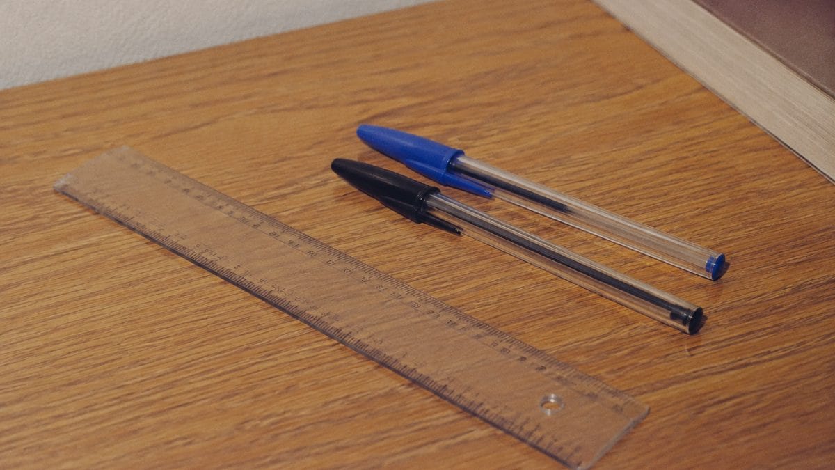 School Supplies Every '80s Kid Needed That Gen Alpha Wouldn't Recognize 10 Real vintage clear plastic ruler next to standard ink pens.