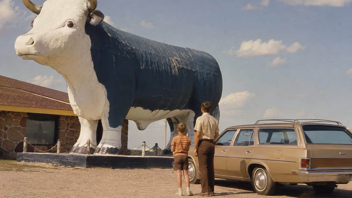 Family at roadside attraction.