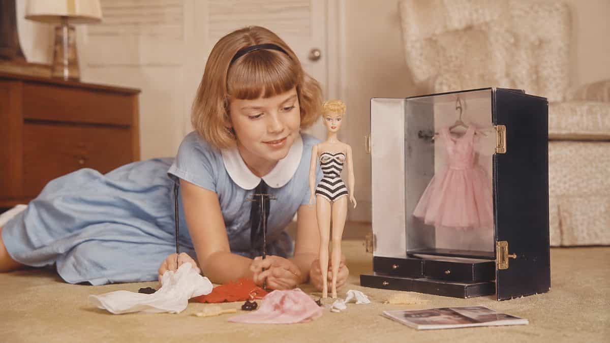 Household Items Every Family Owned That Are Worth a Fortune Now 4 Child playing with a 1960s Barbie.