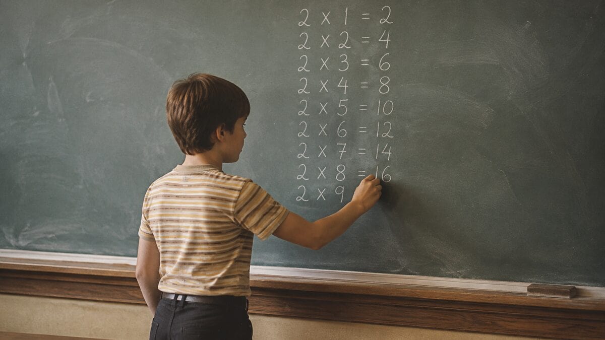 13 Things You Had to Memorize in School That Are Now Obsolete 3 Student doing math at a chalkboard