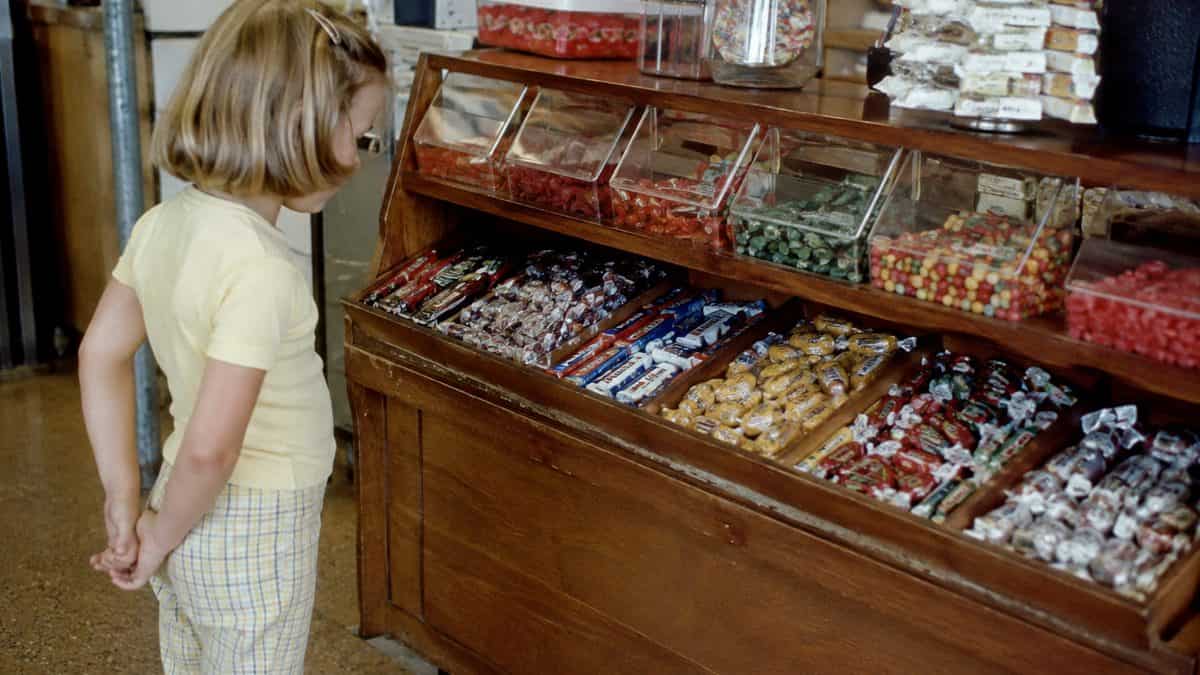 What Kids Used to Do at the Grocery Store That's Unthinkable Now 13 Child at penny candy display