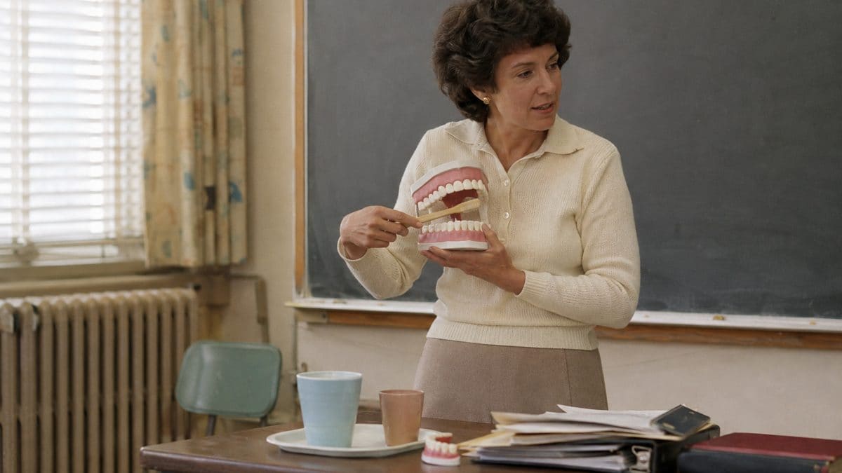 15 School Subjects That Were Required Then but Optional Now 14 Real vintage health class showing a teacher with a dental model
