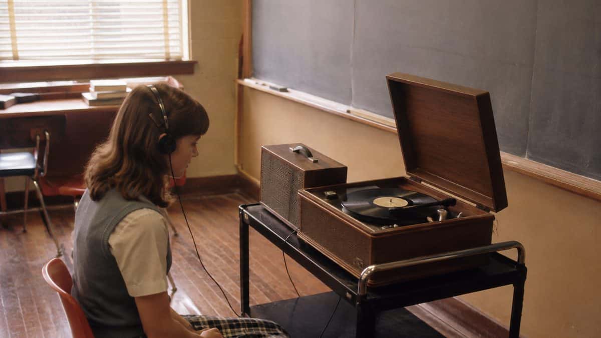 15 School Subjects That Were Required Then but Optional Now 10 Student listening to a record player in a classroom