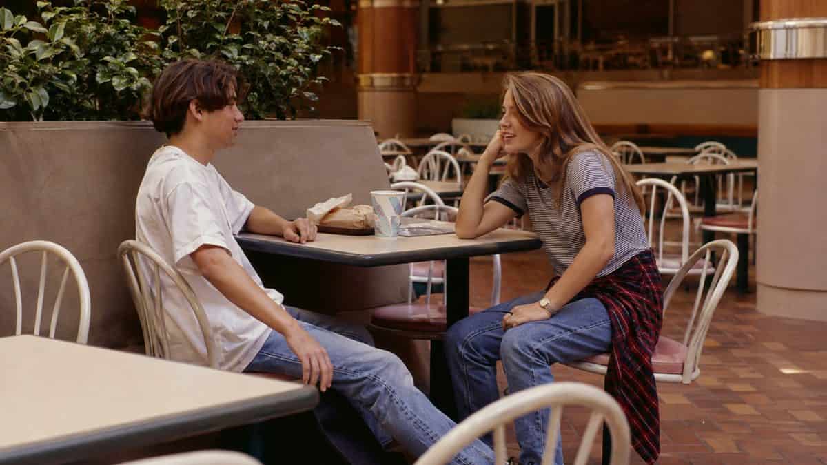 What Kids Did at the Mall That Would Seem Suspicious Today 4 Teenagers hanging out at a mall food court table