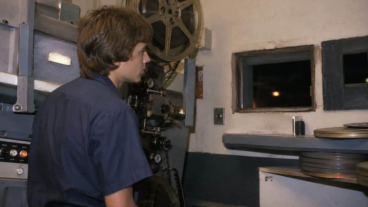 13 Jobs Every High School Kid Could Get That Don't Exist Anymore 2 Teen working as a projectionist