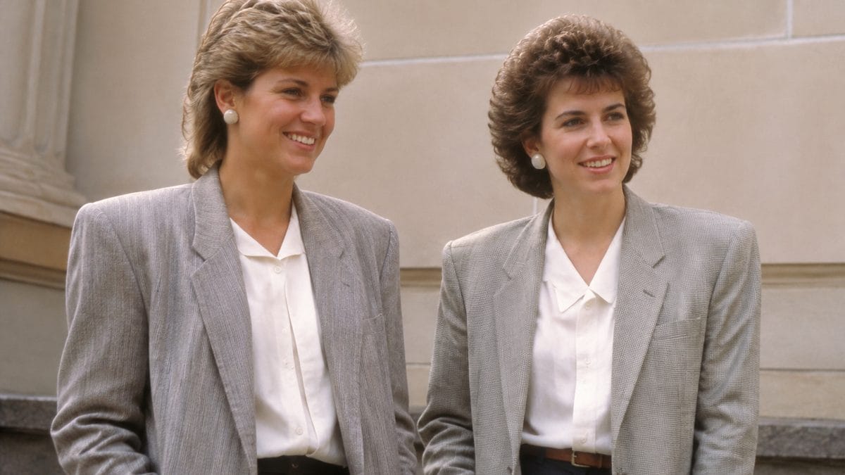 '80s Fashion Trends That Would Break the Internet Today 2 Genuine 1980s photograph of women wearing oversized blazers with shoulder pads, smiling.