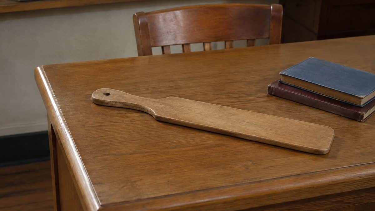 School Punishments That Were Legal Then But Would Be Criminal Now 2 Wooden school paddle on a desk, no people