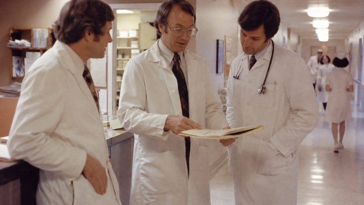 What 1970s Doctors Did That Would Lead to Lawsuits Today 6 Authentic 1970s photo of doctors talking in a hospital
