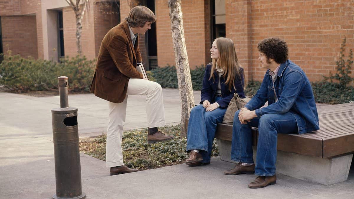 High school students in a designated smoking area.