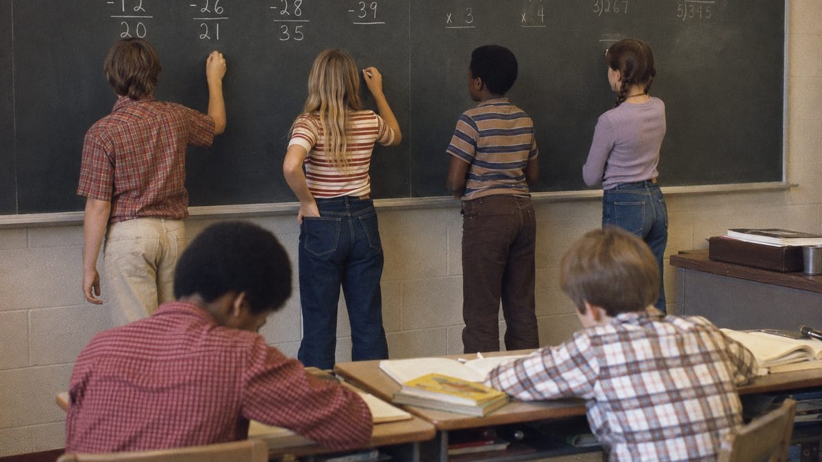 Students doing chalkboard math