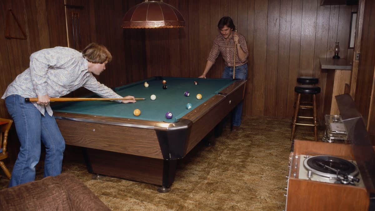 14 Things Every Kid With Wood-Paneled Walls Remembers 7 Real vintage photo of a basement game room with a pool table